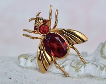 Vintage Bug Brooch Made of Gold Tone Metal with Dark Red Rhinestones by Coro