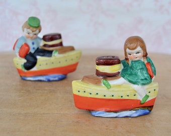Vintage Child Travelers Riding on Ships Ceramic Shaker or Figurine Set Made in Japan