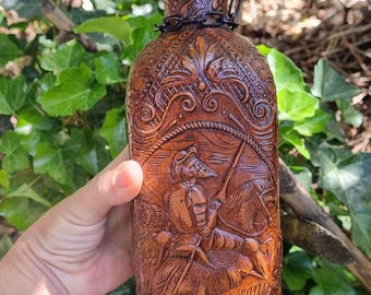 1970s Glass drinking bottle covered with leather, wine bottle
