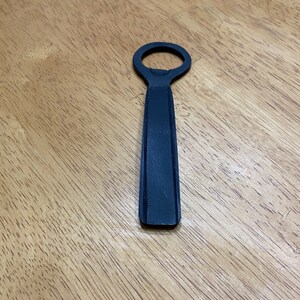 Hand forged bottle opener