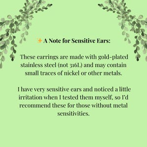 May include: A light green background with text that reads "A Note for Sensitive Ears: These earrings are made with gold-plated stainless steel (not 316L) and may contain small traces of nickel or other metals."