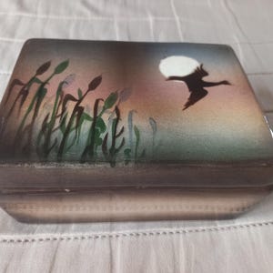 Ceramic box with lid decorated in Japanese style.