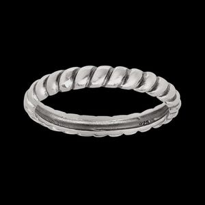 May include: A silver ring with a twisted rope design. The ring is made of a shiny metal and has a smooth, polished finish. The ring is shown against a black background.