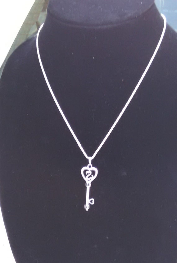 Jane seymour open deals heart key necklace