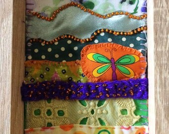 Textile Stitchery (framed) in Emerald, Orange and Purple