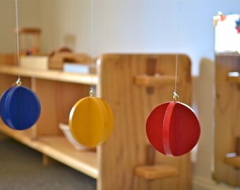 montessori ball toys discs interlocking infant toy cylinder bell mobile primary colors baby