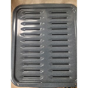 May include: A rectangular, gray oven broiler pan with a speckled finish. The pan features a series of parallel, elongated slots across its surface. The edges are rounded, and there are small holes in the corners.