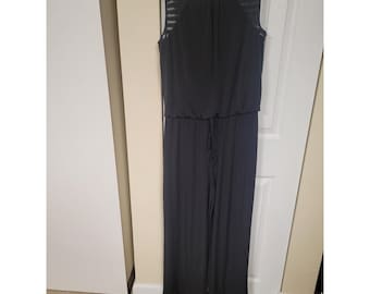 Zwarte jumpsuit met wijde pijpen en mesh schouders, trekkoord in de taille, palazzo model, damesmaat L
