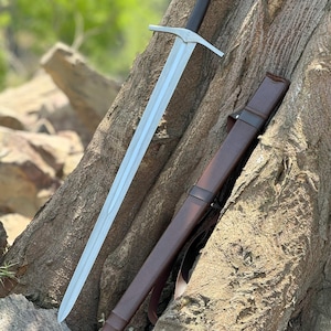 Custom Engraved Sword featuring intricate Norse runes on a high-carbon steel blade. This Viking Sword includes a detailed hilt and matching scabbard. A premium Medieval Sword designed for display, combining the reach of a Longsword with personalized historical artistry.