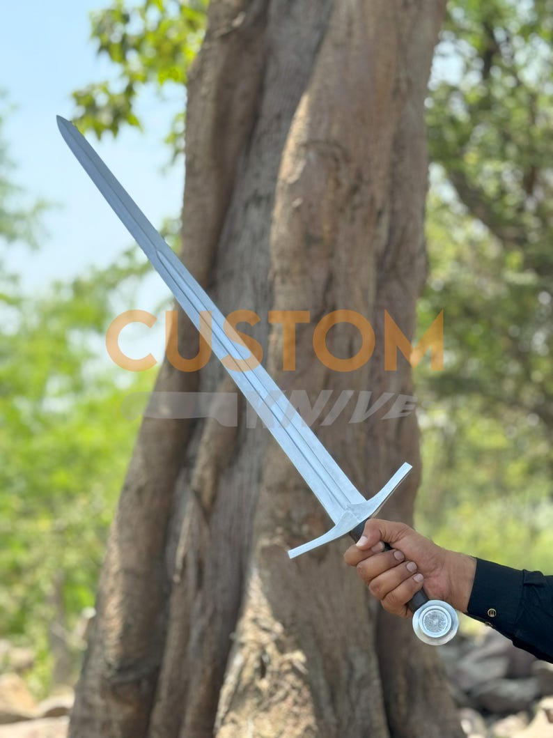 Custom Engraved Sword featuring intricate Norse runes on a high-carbon steel blade. This Viking Sword includes a detailed hilt and matching scabbard. A premium Medieval Sword designed for display, combining the reach of a Longsword with personalized historical artistry.