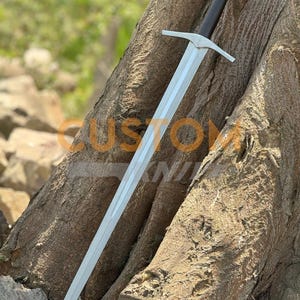 Custom Engraved Sword featuring intricate Norse runes on a high-carbon steel blade. This Viking Sword includes a detailed hilt and matching scabbard. A premium Medieval Sword designed for display, combining the reach of a Longsword with personalized historical artistry.