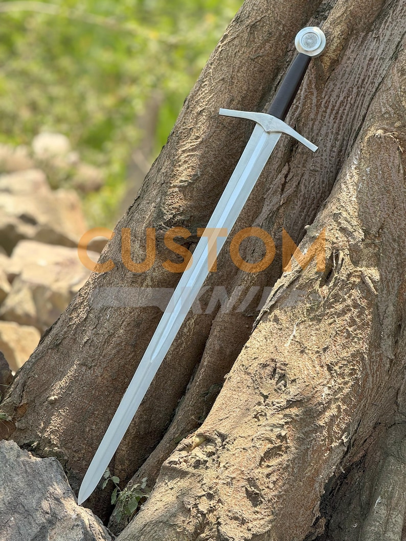 Custom Engraved Sword featuring intricate Norse runes on a high-carbon steel blade. This Viking Sword includes a detailed hilt and matching scabbard. A premium Medieval Sword designed for display, combining the reach of a Longsword with personalized historical artistry.