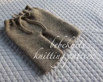May include: Knitting pattern for baby pants. The pants are beige and have a drawstring. The text "bebeknits knitting pattern" is visible on the image.