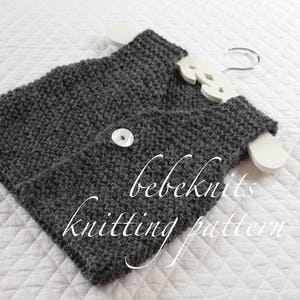 May include: A grey knitted vest with a white button and the text "bebeknits knitting pattern".