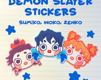 May include: Three Demon Slayer stickers featuring stylized character heads of Sumiko, Inoko, and Zenko. The text reads DEMON SLAYER STICKERS SUMIKO, INOKO, ZENKO. The stickers are surrounded by blue star shapes on a lined paper background.