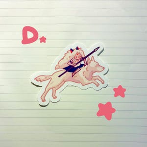 May include: A sticker featuring a cartoon illustration of a character riding a wolf, holding a spear. The character has white hair and red horns. Pink stars and the letter "D" are also present.