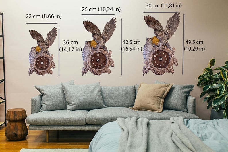 May include: Three wall clocks featuring a brown owl design with spread wings, perched on a textured base. The clocks are shown in three sizes: 22 x 36 cm, 26 x 42.5 cm, and 30 x 49.5 cm, with clear dimension labels provided for each individual clock.