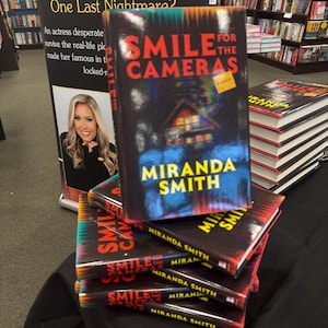 Smile for the Cameras—Signed Copy