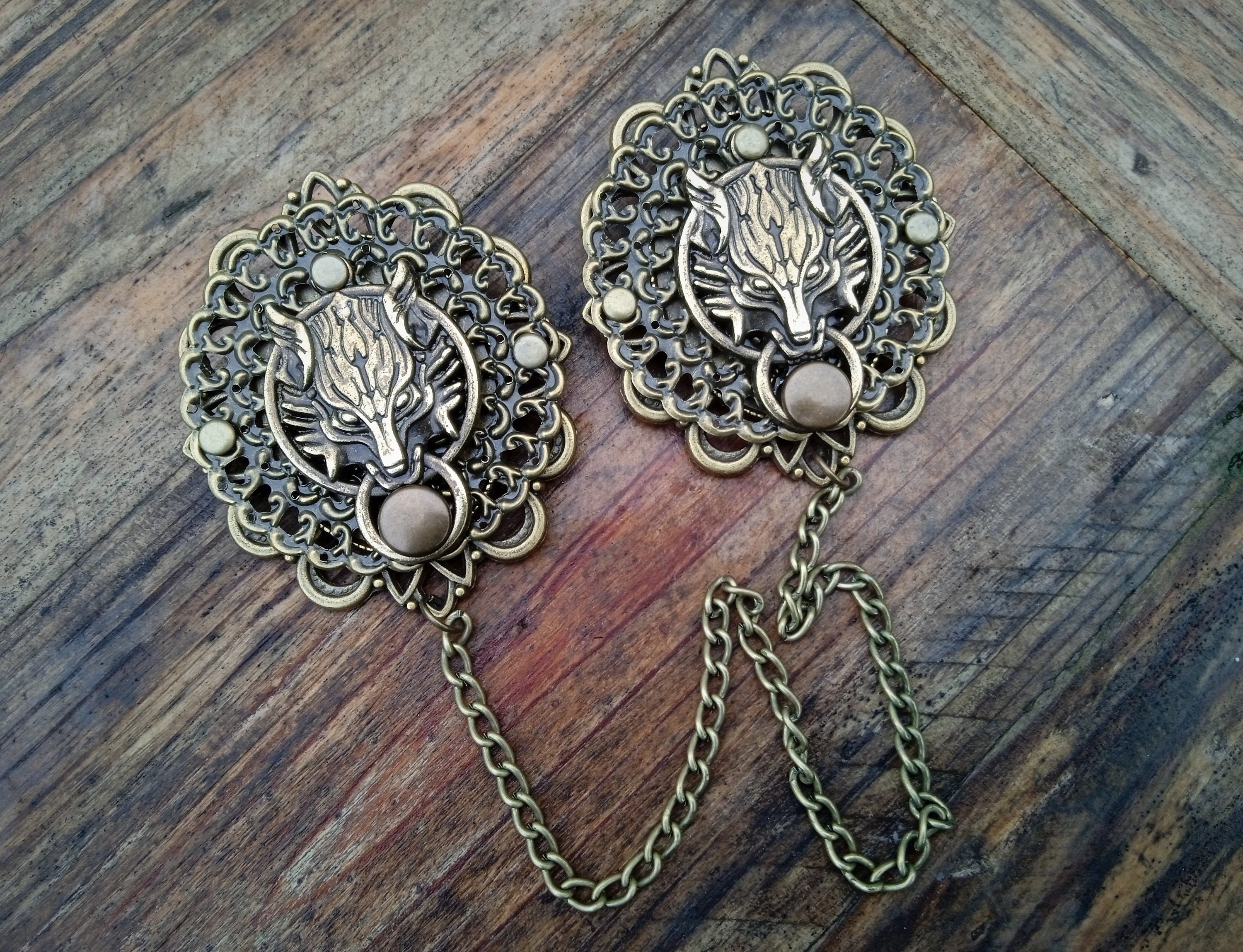 Cloak brooch store