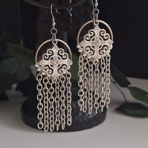 earrings with chains and silver croos