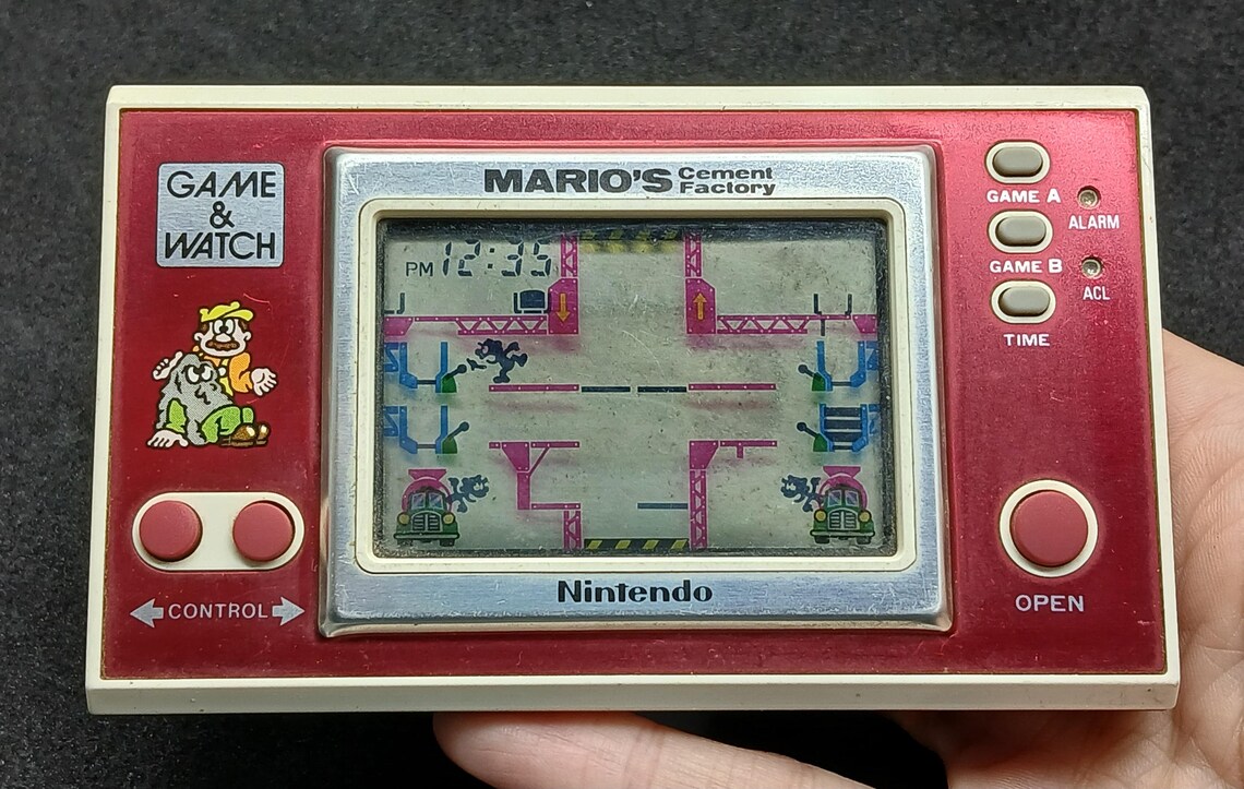 Vintage Consola Nintendo Game & Watch Modelo N•ML-102 Mario's Cement Factory Made in Argentina, foto 1 di 5