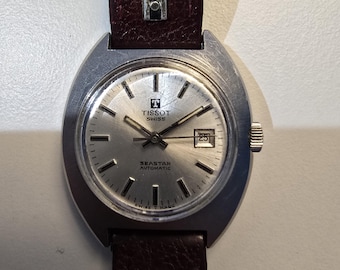 Orologio Tissot Seastar automatico svizzero vintage, quadrante argentato a raggiera, cassa in acciaio a cuscino, anni '70.