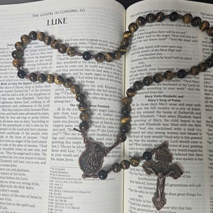 Handmade Rosary with Tigers&#39; eye beads, Pardon Crucifix and Saint Michael Center.