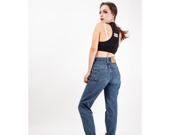 Vintage Levis 505 / 1990s Medium wash denim straight leg jeans / Unisex S M