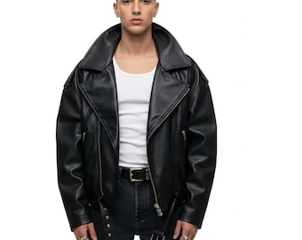 May include: Black leather jacket with an oversized fit, featuring a wide lapel collar, asymmetrical zipper closure, and a belt at the waist. The jacket is paired with black jeans and a white undershirt. The overall style is edgy and modern.
