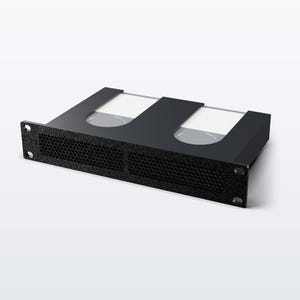 May include: A black rack-mount chassis featuring a front panel with two rectangular mesh ventilation sections. The top surface includes two recessed cutouts, each containing a white rectangular insert with a circular indentation in the center.