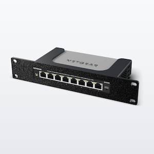 May include: A black and grey Netgear GS308E network switch featuring eight Ethernet ports on the front panel. The device includes a rack-mount bracket with mounting holes on each side and a status indicator light next to the ports.