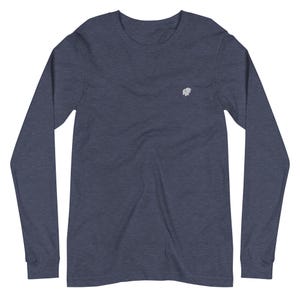 May include: A navy blue long-sleeved shirt featuring a small, embroidered white elephant logo on the chest. The shirt has a crew neck and a soft appearance, suitable for casual wear.