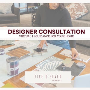 May include: Image promoting designer consultation services. The image features a person working on a table with design samples, paint cans, and blueprints. Text reads "DESIGNER CONSULTATION" and "VIRTUAL 1:1 GUIDANCE FOR YOUR HOME". The logo for "FIVE O SEVEN INTERIORS" is also visible.