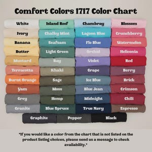 May include: A Comfort Colors 1717 color chart displaying folded t-shirts in various shades including white, ivory, banana, butter, mustard, terracotta, burnt orange, yam, grey, granite, island reef, chalky mint, seafoam, light green, bay, khaki, sage, moss, hemp, blue spruce, graphite, pepper, chambray, lagoon blue, flo blue, orchid, violet, grape, ice blue, blue jean, midnight, true navy, blossom, crunchberry, watermelon, heliconia, red, berry, brick, crimson, chili, espresso, and black.