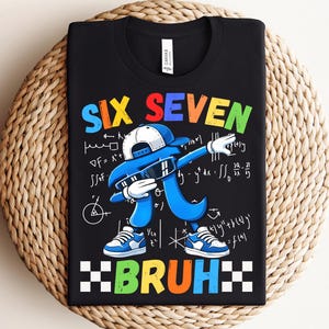 May include: Black t-shirt with the words "SIX SEVEN BRUH" in colorful letters. The shirt features a blue cartoon character dabbing, wearing a hat and sunglasses, with mathematical equations in the background. The character is wearing blue sneakers.