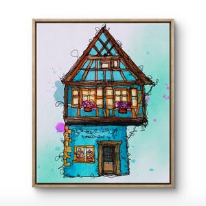 Puede incluir: Pintura a la acuarela de una casa azul caprichosa con estructura de madera marrón y tejado inclinado. La casa tiene varias ventanas con jardineras y una puerta de madera. La obra está enmarcada en un marco de madera clara. El texto "Frameit App/Tablet/Web" está en la parte inferior.