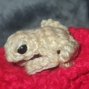 Coquí tejido a crochet