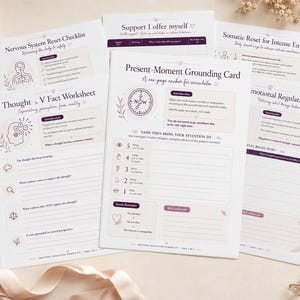 May include: A collection of white paper worksheets and cards with dark purple text and line art illustrations. Titles include Present-Moment Grounding Card, Thought vs Fact Worksheet, Nervous System Reset Checklist, and Emotional Regulation Tracker.