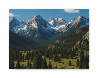 May include: Canvas print of a mountain landscape. Snow-capped peaks rise above a valley filled with evergreen trees. The sky is a clear blue with a few white clouds. The canvas is rectangular.