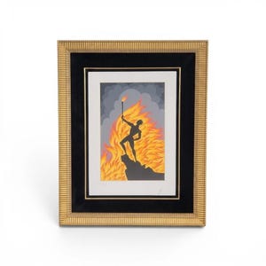 May include: A framed art print featuring a black silhouette of a figure standing on a rocky outcrop, holding a flaming torch against a backdrop of bright orange and yellow flames and grey clouds, enclosed in a textured gold frame with a black mat.