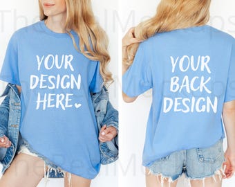 May include: Light blue t-shirt with the text "YOUR DESIGN HERE" on the front and "YOUR BACK DESIGN" on the back. The shirt is a short-sleeved crew neck style.