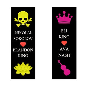 May include: Two black bookmarks with white text and colorful graphics. One bookmark has a yellow skull and crossbones, a red heart, and a yellow lotus flower. The other has a pink crown, a red heart, and a pink violin.