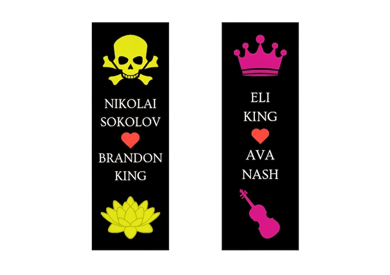 May include: Two black bookmarks with white text and colorful graphics. One bookmark has a yellow skull and crossbones, a red heart, and a yellow lotus flower. The other has a pink crown, a red heart, and a pink violin.