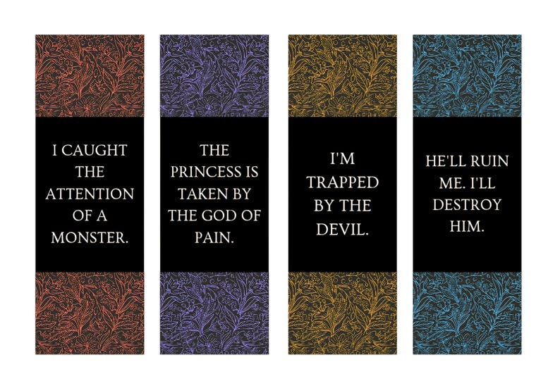 May include: Four rectangular bookmarks with floral patterned backgrounds in red, purple, yellow, and blue. Each bookmark has a black bar with white text: "I CAUGHT THE ATTENTION OF A MONSTER."