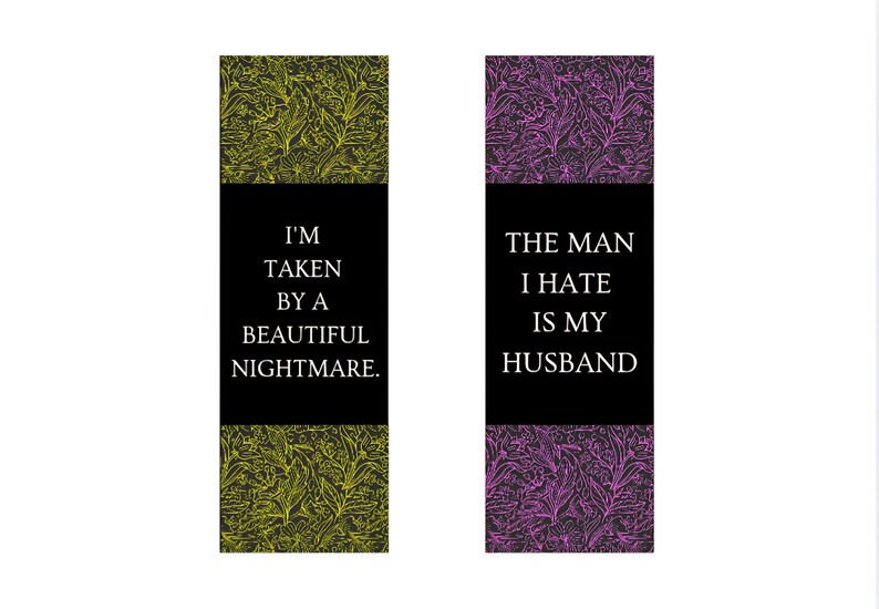 May include: Two rectangular bookmarks with floral patterns. One has a yellow-green design, the other a purple design. Each has a black section with white text. One says "I'M TAKEN BY A BEAUTIFUL NIGHTMARE." The other says "THE MAN I HATE IS MY HUSBAND."