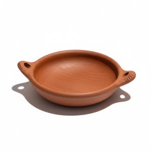 May include: A terracotta-colored, shallow bowl with two handles. The handles have a decorative, textured design. The bowl is round with a smooth interior and is likely made of clay.