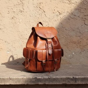 Handmade brown leather backpack with vintage design and front buckle pockets, rustic travel rucksack for work, college, hiking and everyday carry