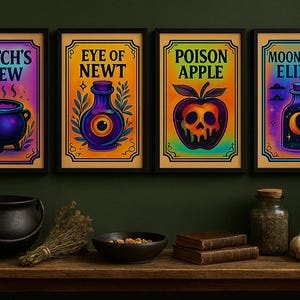 May include: Four framed art prints with colourful illustrations of potion ingredients and a cauldron. The prints feature text like "Witch's Brew" and "Moonlight Elixir." A black cauldron, books, and a candle are on a wooden surface.