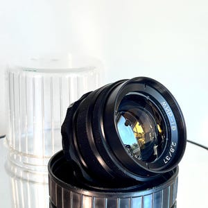 May include: A rustic wooden sign with the text "Welcome to our home" in white lettering. The sign features a distressed finish and a simple, inviting design, perfect for entryway decor.