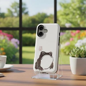 May include: A set of three ceramic mugs with a speckled, matte finish. The mugs are in shades of cream, light gray, and dark gray. Each mug has a simple, minimalist design, perfect for coffee or tea.